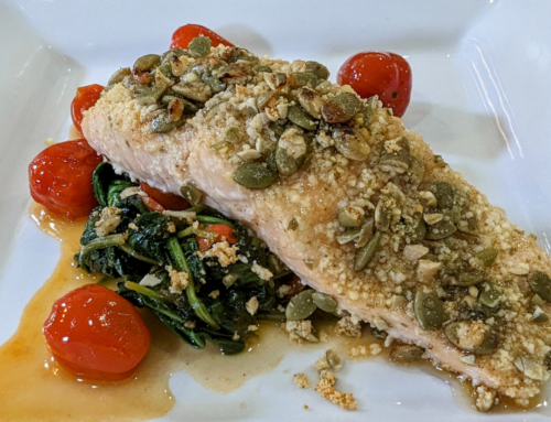 Parmesan and Pumpkin Seed Crusted salmon served with Wilted Spinach and Tomatoes