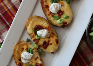 Irresistible Cheesy Stuffed Potato Boats with Bacon, Sour Cream and Green onions recipe